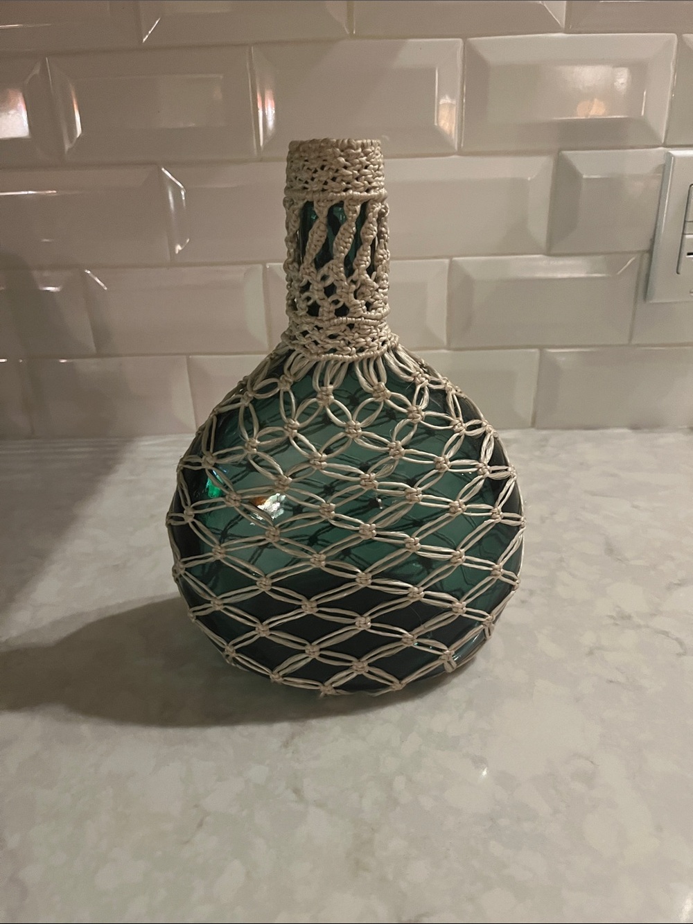 Vintage Bohemian Macrame covered green bottle. Hand crafted